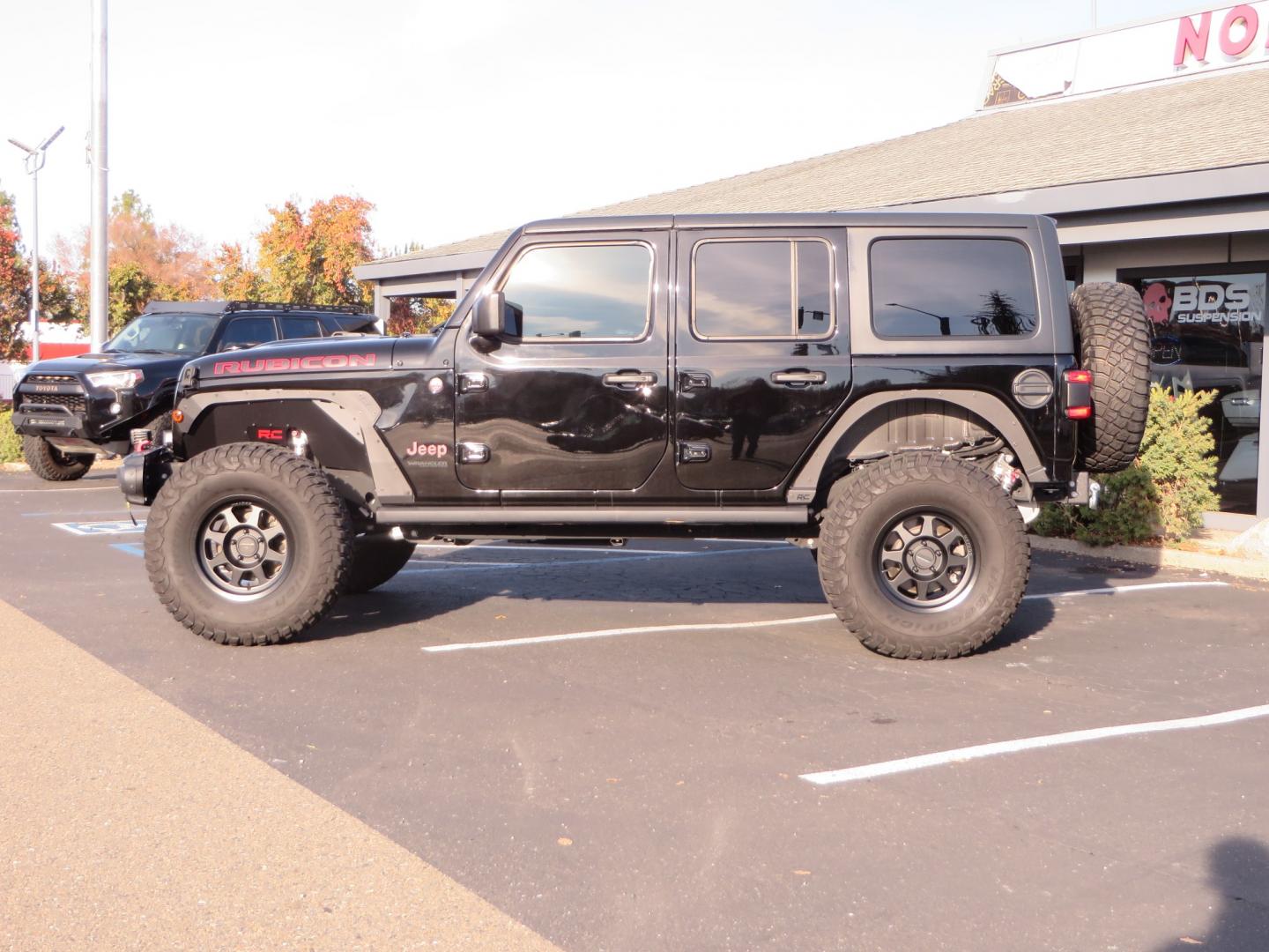 2018 BLACK /BLACK Jeep Wrangler JL Unlimited Rubicon (1C4HJXFG0JW) with an 3.6L V6 DOHC 24V engine, automatic transmission, located at 2630 Grass Valley Highway, Auburn, CA, 95603, (530) 508-5100, 38.937893, -121.095482 - JL Rubicon sitting on Teralfex suspension, Falken fast adjust shocks, Method wheels, BFG KM3 tires, Smittybilt winch, Rigid Leds, window tint, RC Fender eliminators, DV8 rear bumper, Smittybilt HD hinge kit, and a terflex spare tire relocation. - Photo#7